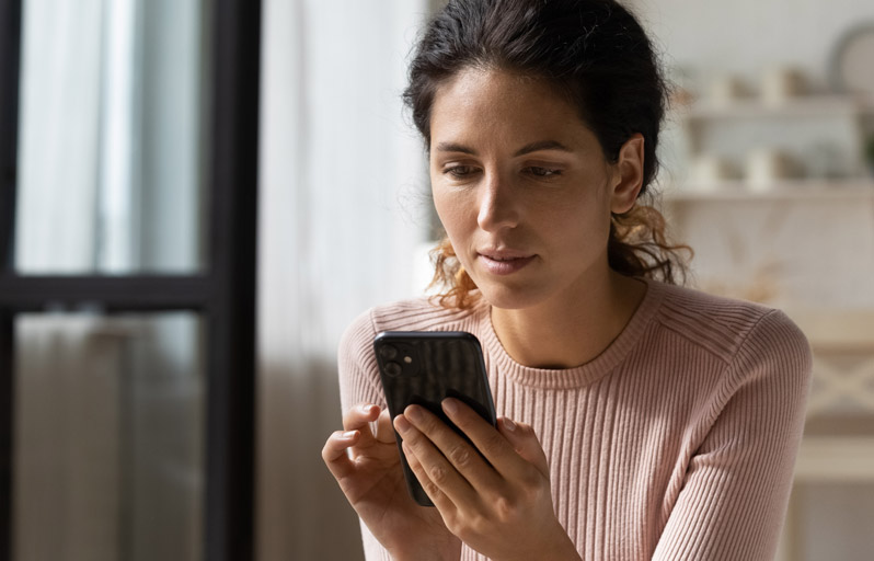 Woman using a debit card for an online purchase