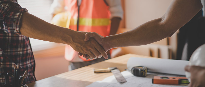 Shaking hands with contractor