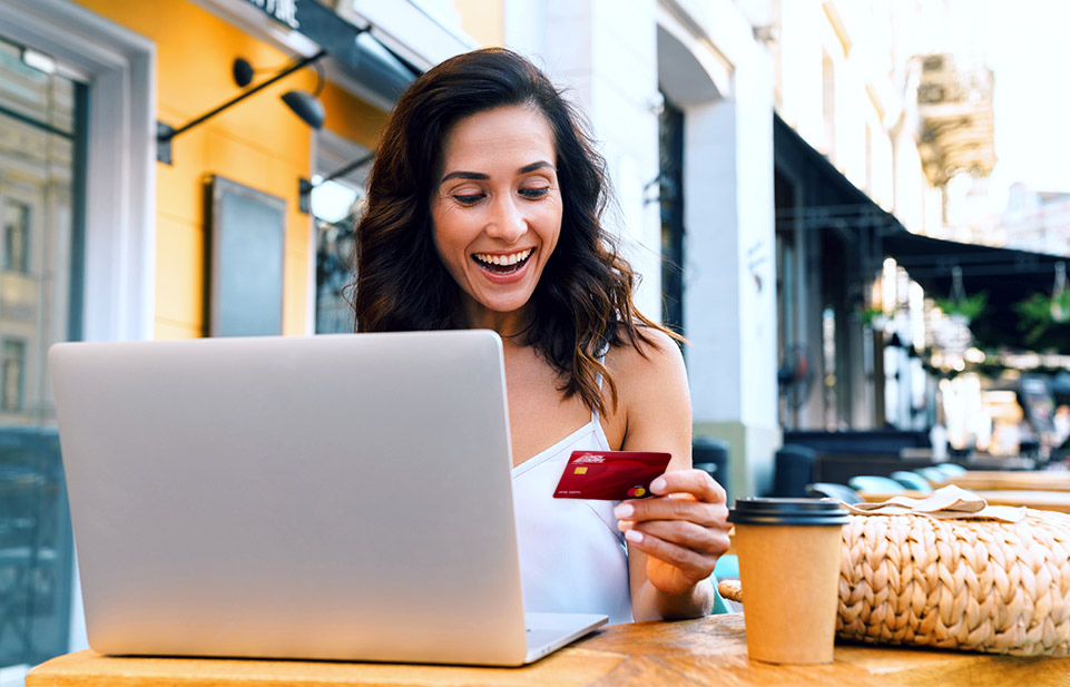 Young couple sitting on couch looking at tablet